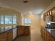 Open kitchen boasts granite countertops, stainless steel appliances, and ample cabinet space at 2855 Grande Valley Dr, Las Vegas, NV 89135