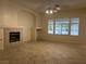 Open-concept living room features a cozy fireplace at 2855 Grande Valley Dr, Las Vegas, NV 89135