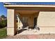 Covered back patio with lots of natural light and space for outdoor seating and relaxation at 325 Wild Plum Ln, Las Vegas, NV 89107