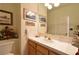 Powder room with decorative wall art and a white countertop at 325 Wild Plum Ln, Las Vegas, NV 89107