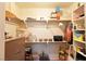 Well-organized walk in closet with multiple shelves for storing various items and belongings at 325 Wild Plum Ln, Las Vegas, NV 89107