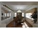 Bright dining room boasts a chandelier, natural light, and lovely decor at 325 Wild Plum Ln, Las Vegas, NV 89107