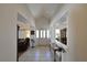 Bright and spacious foyer with tile flooring, high ceilings, and a view into the living area at 325 Wild Plum Ln, Las Vegas, NV 89107