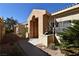 Attractive front entrance with desert landscaping, a covered entryway, and beautiful curb appeal at 325 Wild Plum Ln, Las Vegas, NV 89107