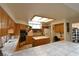 Kitchen with wooden cabinets, tile countertops and floors, plus a center island at 325 Wild Plum Ln, Las Vegas, NV 89107