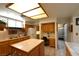 Spacious kitchen with an island, white appliances, and plenty of counter space at 325 Wild Plum Ln, Las Vegas, NV 89107