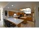 Spacious eat-in kitchen with wooden cabinetry and tile flooring at 325 Wild Plum Ln, Las Vegas, NV 89107