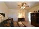 A spacious living room with a ceiling fan, comfortable seating, and lots of natural light at 325 Wild Plum Ln, Las Vegas, NV 89107