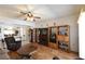 Open-concept living room with wood floors, a ceiling fan, and ample space for furniture at 325 Wild Plum Ln, Las Vegas, NV 89107