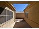 Private walkway leading to a walled backyard patio at 325 Wild Plum Ln, Las Vegas, NV 89107