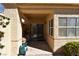 Covered patio with textured columns, offering shade and a comfortable outdoor seating area at 325 Wild Plum Ln, Las Vegas, NV 89107