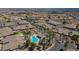 Aerial view of a neighborhood with community pool, well-maintained streets, and green landscaping at 3342 Pheasant Canyon Way # 1013, Laughlin, NV 89029