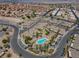 Aerial view of a neighborhood showcasing community amenities like a pool, green space, and well-planned streets at 3342 Pheasant Canyon Way # 1013, Laughlin, NV 89029