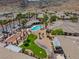 Aerial view of community pool, putting green, shuffleboard and lush landscaping at 3342 Pheasant Canyon Way # 1013, Laughlin, NV 89029