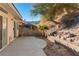 The home features a partially covered patio with a desert-inspired backyard at 3342 Pheasant Canyon Way # 1013, Laughlin, NV 89029