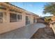 The backyard features a desert landscape with an extended covered patio perfect for entertaining at 3342 Pheasant Canyon Way # 1013, Laughlin, NV 89029