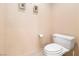 Neutral bathroom with toilet and soft peach colored walls at 3342 Pheasant Canyon Way # 1013, Laughlin, NV 89029