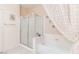 Clean bathroom features a shower over tub with glass doors and tile flooring at 3342 Pheasant Canyon Way # 1013, Laughlin, NV 89029