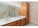 This bathroom has a double vanity, large mirror, tub, shower, and lots of cabinet space at 3342 Pheasant Canyon Way # 1013, Laughlin, NV 89029