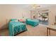 Carpeted bedroom with twin beds, ceiling fan, slider to the backyard, and a mountain view at 3342 Pheasant Canyon Way # 1013, Laughlin, NV 89029