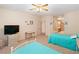 Carpeted bedroom featuring twin beds, ceiling fan, TV, and access to a bathroom at 3342 Pheasant Canyon Way # 1013, Laughlin, NV 89029