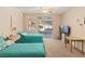 This bedroom features two twin beds, carpet, sliding door access to the backyard, and backyard views at 3342 Pheasant Canyon Way # 1013, Laughlin, NV 89029