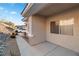 Exterior of home, showcasing tan stucco, well-maintained landscaping, and a covered entryway at 3342 Pheasant Canyon Way # 1013, Laughlin, NV 89029