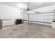 An empty two car garage offers space for vehicles and storage at 3342 Pheasant Canyon Way # 1013, Laughlin, NV 89029