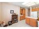 Bright kitchen boasts white appliances, tiled floors, ample cabinet space, and an island at 3342 Pheasant Canyon Way # 1013, Laughlin, NV 89029