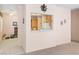 Open living area features a pass-through window to the kitchen, connecting spaces with natural light at 3342 Pheasant Canyon Way # 1013, Laughlin, NV 89029