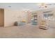 Spacious living room provides access to the outdoors via a sliding door, with bright natural lighting at 3342 Pheasant Canyon Way # 1013, Laughlin, NV 89029