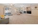 Expansive living room offers a cozy fireplace, sliding glass doors, and ample seating space at 3342 Pheasant Canyon Way # 1013, Laughlin, NV 89029