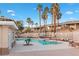 Community pool area surrounded by palm trees and lounge chairs; well-maintained and inviting at 3342 Pheasant Canyon Way # 1013, Laughlin, NV 89029