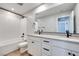 Contemporary bathroom featuring a double sink vanity, subway tile shower, and modern fixtures, creating a spa-like atmosphere at 3357 Via Tizzoni St, Henderson, NV 89044