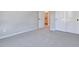 Neutral bedroom with plush carpet and access to an open closet space, offering a comfortable and functional living area at 3357 Via Tizzoni St, Henderson, NV 89044