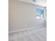 Bright bedroom showing neutral walls with carpeted flooring and a view of neighboring houses at 3357 Via Tizzoni St, Henderson, NV 89044