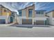 Modern townhome showcasing contemporary architecture, neutral color palettes, and a convenient two-car garage at 3357 Via Tizzoni St, Henderson, NV 89044