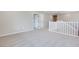 Bright hallway boasts neutral walls, plush carpet, and access to various rooms, creating a seamless transition throughout the home at 3357 Via Tizzoni St, Henderson, NV 89044