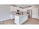Modern kitchen featuring stainless steel appliances, quartz countertops, and a central island at 3357 Via Tizzoni St, Henderson, NV 89044