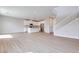 Bright, open-concept living space features hardwood floors, a modern kitchen, and a staircase at 3357 Via Tizzoni St, Henderson, NV 89044