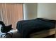 Cozy bedroom with a large bed, and modern office chair beside the window at 3550 Bay Sands Dr # 3051, Laughlin, NV 89029