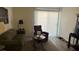 Cozy living room featuring an olive sofa, brown recliner and natural light from sliding glass door at 3550 Bay Sands Dr # 3051, Laughlin, NV 89029