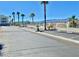 View of street with parking spots and lush landscaping and well maintained landscaping at 3550 Bay Sands Dr # 3051, Laughlin, NV 89029