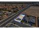 Aerial view of a home with a kidney-shaped pool, new landscaping, and convenient street access at 3556 Valley Lily St, North Las Vegas, NV 89032