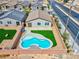 Aerial view of a home with a kidney-shaped pool, new landscaping, and fenced yard at 3556 Valley Lily St, North Las Vegas, NV 89032