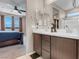 Bathroom featuring double sinks and glass-enclosed shower with views into the main bedroom at 3556 Valley Lily St, North Las Vegas, NV 89032