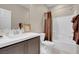 Bright bathroom with tub and shower combination, and neutral flooring at 3556 Valley Lily St, North Las Vegas, NV 89032