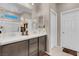 Bathroom features a double sink vanity, shower with glass door, and neutral walls at 3556 Valley Lily St, North Las Vegas, NV 89032