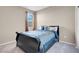 Comfortable bedroom with window and neutral walls at 3556 Valley Lily St, North Las Vegas, NV 89032