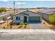 Charming single-story home with a well-manicured front yard and a two car garage at 3556 Valley Lily St, North Las Vegas, NV 89032